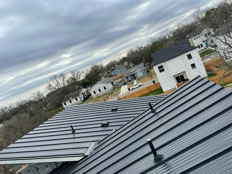 Standing seam metal roof panels with vents for Skylight Repair in Maplewood